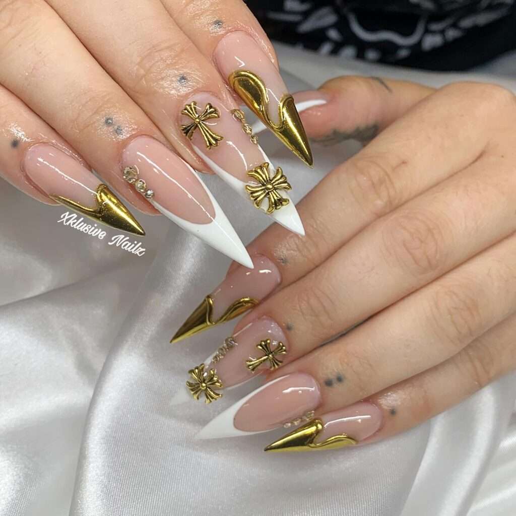 white and gold stiletto nails